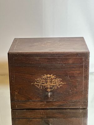 a small wooden box sitting on top of a table
