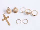 five rings and a cross on a white surface