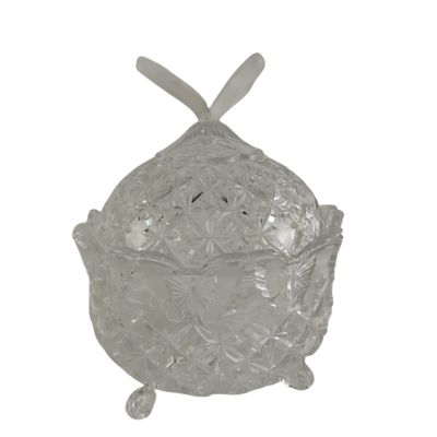 a clear glass bowl with a bow on top of it