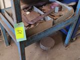 a blue workbench with a lot of tools on it
