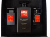 a black box with two bottles of perfume and a bottle of cologne