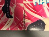 a book with a picture of a woman in high heels on it