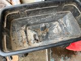 a dirty pan that is sitting on the ground