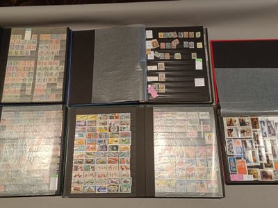 many different types of stamps on the pages of a binder