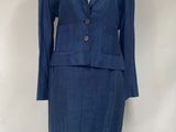 blue suit on a mannequin stand against a white backdrop
