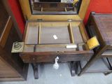 a wooden desk with a mirror and a mirror on it