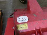 a red tractor with a sticker on the front