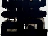 a black and white painting of a cityscape on the wall