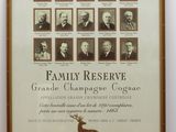 an old photo of a family reserve poster on a table