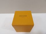 yellow louis vuitton box on a white surface