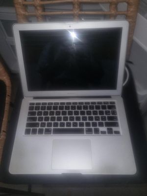 a laptop computer that is sitting on a table