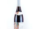 the bottle of wine has sprinkles all over it