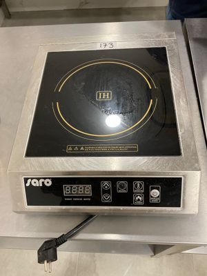 an image of a stove top with a black burner on it