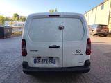 a white van that is parked in a parking lot