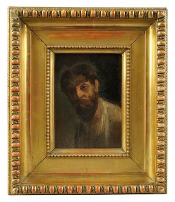 un tableau représentant un homme barbu dans un cadre en or
