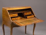 a wooden desk with drawers and a drawer underneath it