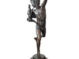 bronze statue of a boy holding a bird on a wooden base