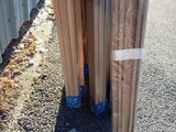 two rolls of cardboard sitting on the side of the road
