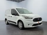 the white van is parked in a large room