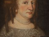 portrait of a woman in a black dress with a red flower in her hair