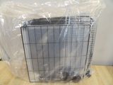 packaged air conditioner sitting on top of a wooden table in a room
