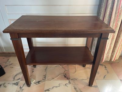 a wooden table with a shelf on top of it