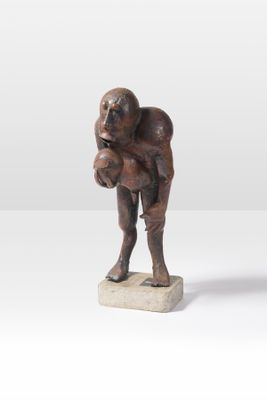 statue of a man holding a baby in his arms