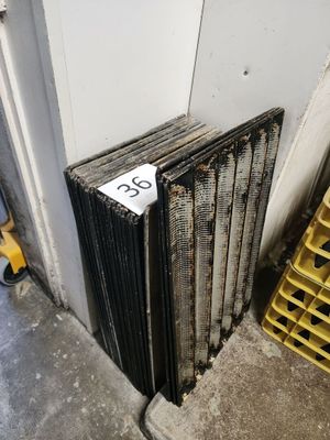 a radiator sitting next to a stack of crates