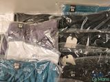 several pairs of underwear are packed in plastic bags on a shelf