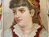 a picture of a woman with a hat on a wall