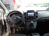 the interior of a small car with a steering wheel and dashboard