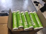 six rolls of toilet paper in a box on the floor
