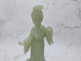 chinese carved jade figurine of a woman holding a flower