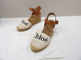 pair of white and brown espadrills with the word chloe on them