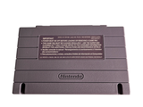 a nintendo game console sitting on top of a white surface