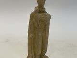 an old statue of a man with a cape on a white background