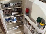 an open refrigerator with a lot of food inside of it