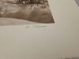 an old photo of a man riding a horse in the snow