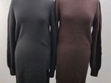two dresses on a mannequin stand in front of a white background