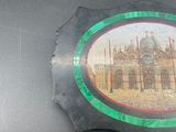 a picture of a picture of a building on a plate