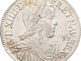 an old silver coin with a woman ' s head on it