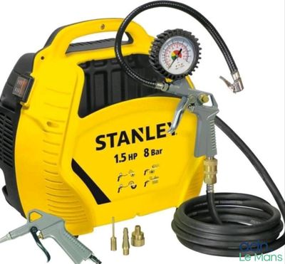a close up of a yellow and black air compressor on a white background