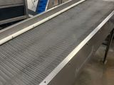 a conveyor belt in the middle of a factory