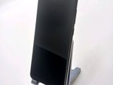 a cell phone that is sitting on a stand