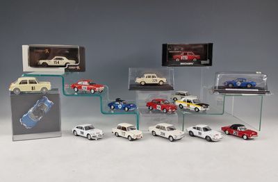 a lot of cars that are on display in a display case