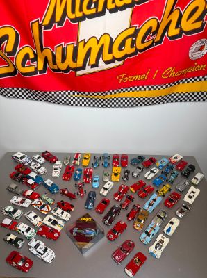 a lot of toy cars that are on a table