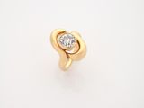 a gold ring with a diamond in the center