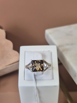 a ring that is sitting in a box on a table