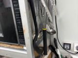 a microwave that is sitting on a shelf in a kitchen