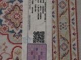 a label on a rug with a price tag on it